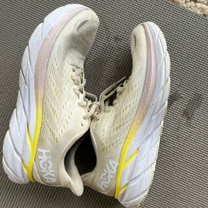 White with light yellow and pink Hoka Clifton 8’s